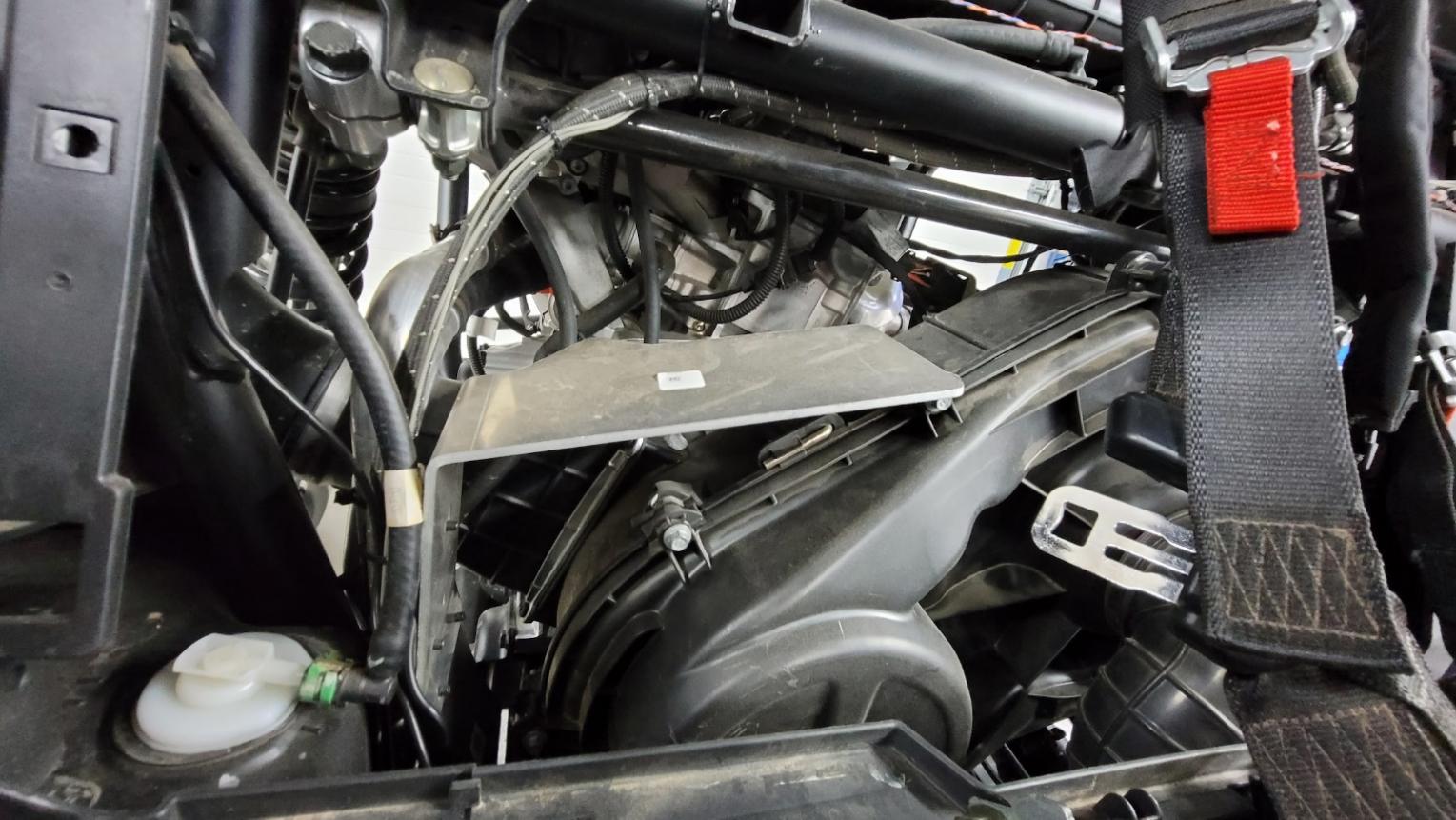 Close-up of a car engine
        
        Description automatically generated