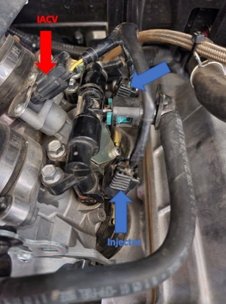 Close-up of a car engine

Description automatically generated