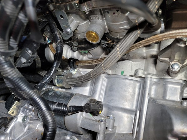 Close-up of a car engine

Description automatically generated