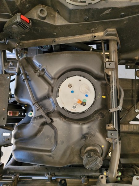 A close-up of a car engine

Description automatically generated